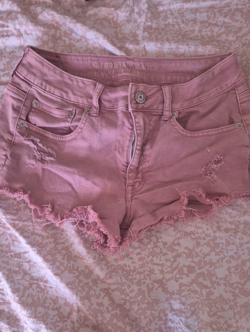 AE PINK DISTRESSED DENIM SHORTS